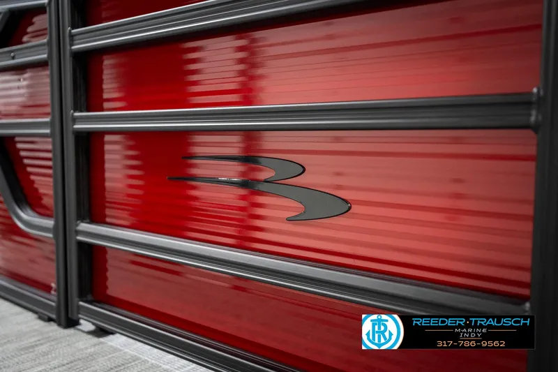 Slide: The Image of 2025 Bennington 22 SSR boat with sleek red and black design, Reeder-Trausch Marine logo. - 45