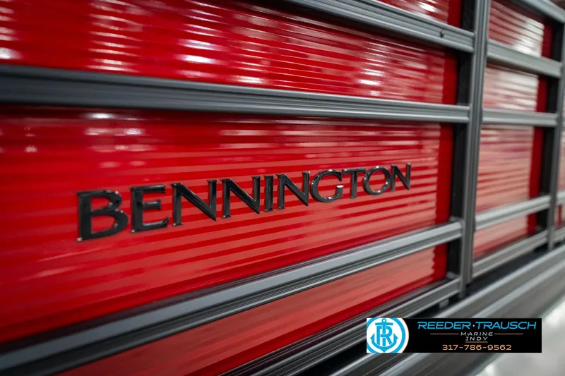 Slide: The Image of Bennington 22 SSR 2025 boat with red paneling and black trim, Reeder-Trausch Marine logo. - 46