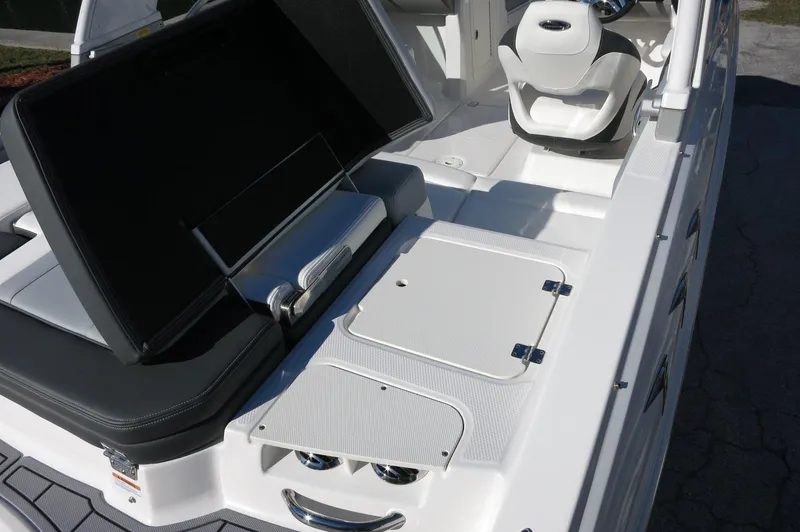 Slide: The Image of 2025 Chaparral 21 SSi Outboard boat interior with seating and storage compartments. - 13