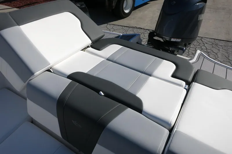 Slide: The Image of 2025 Chaparral 21 SSi Outboard boat interior with gray and white seating. - 15