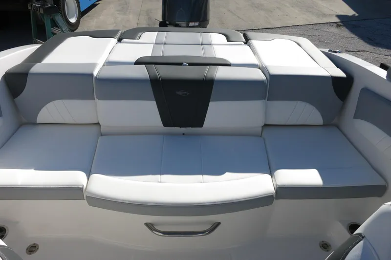Slide: The Image of 2025 Chaparral 21 SSi Outboard boat with sleek white and gray seating. - 17