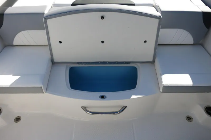 Slide: The Image of 2025 Chaparral 21 SSi Outboard boat seating with storage compartment. - 22