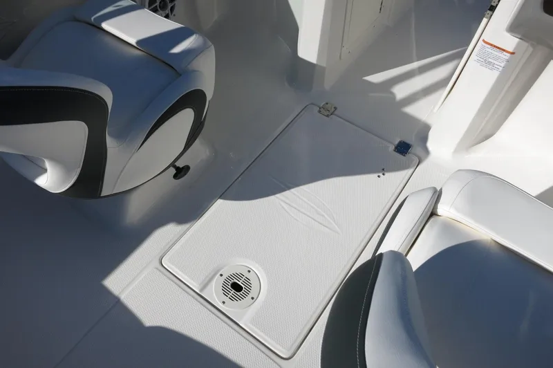 Slide: The Image of Interior of 2025 Chaparral 21 SSi Outboard boat, featuring seating and deck details. - 27