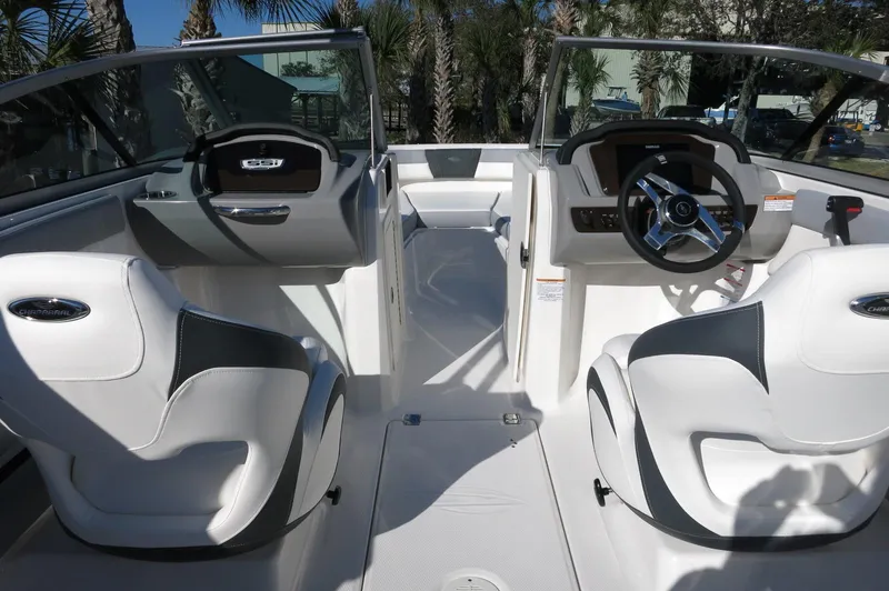 Slide: The Image of 2025 Chaparral 21 SSi Outboard boat interior with modern seating and steering wheel. - 43