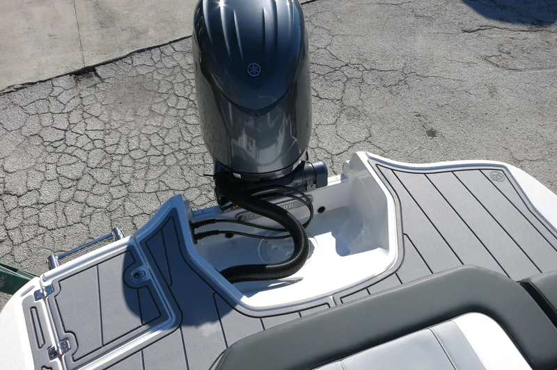 Slide: The Image of 2025 Chaparral 21 SSi Outboard boat with sleek deck and powerful engine. - 44