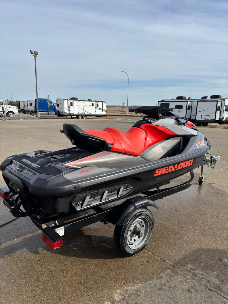 Slide: The Image of 2023 Sea-Doo GTI SE 170 jet ski with red seat on a trailer. - 4