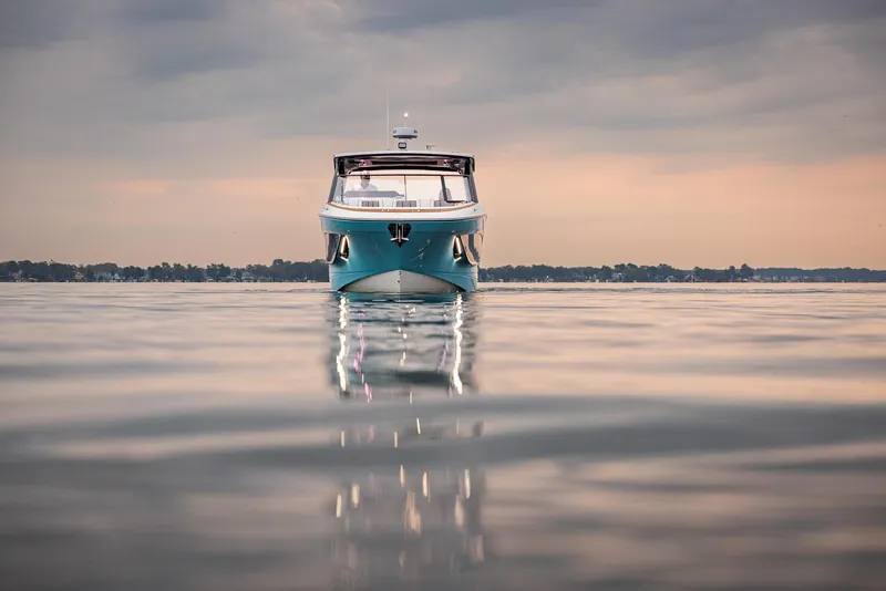 Slide: The Image of 2026 Hurricane SunDeck 3200 OB boat kitchenette with sink and storage. - 16