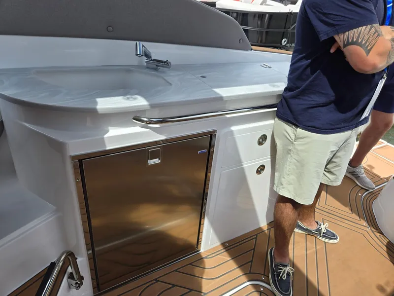 Slide: The Image of 2026 Hurricane SunDeck 3200 OB throttle control and dashboard details. - 25