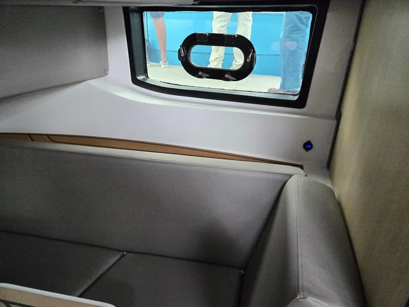 Slide: The Image of 2026 Hurricane SunDeck 3200 OB dashboard view with boats in the background. - 28