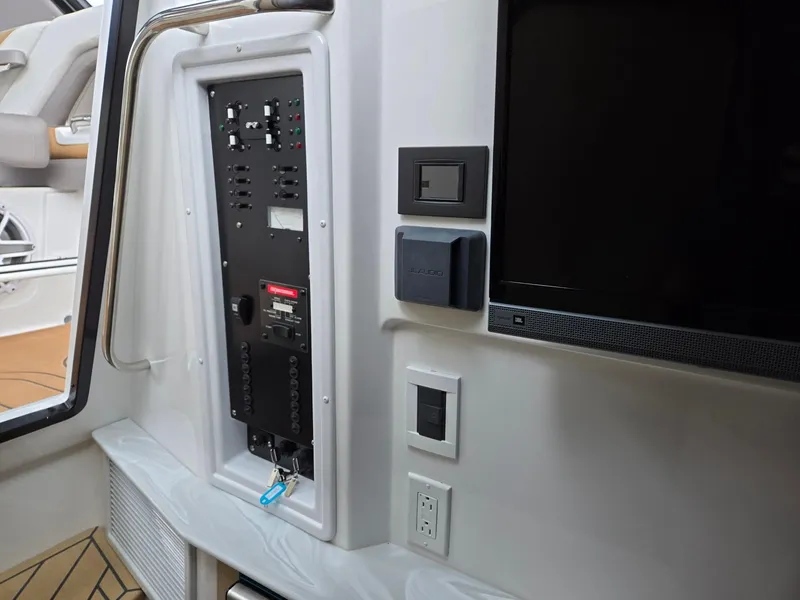 Slide: The Image of 2026 Hurricane SunDeck 3200 OB boat seat with armrests and patterned upholstery. - 30