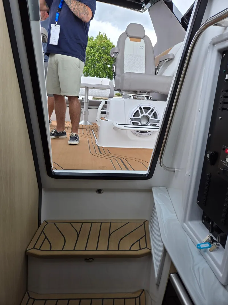 Slide: The Image of 2026 Hurricane SunDeck 3200 OB dashboard with sleek controls and modern design. - 31