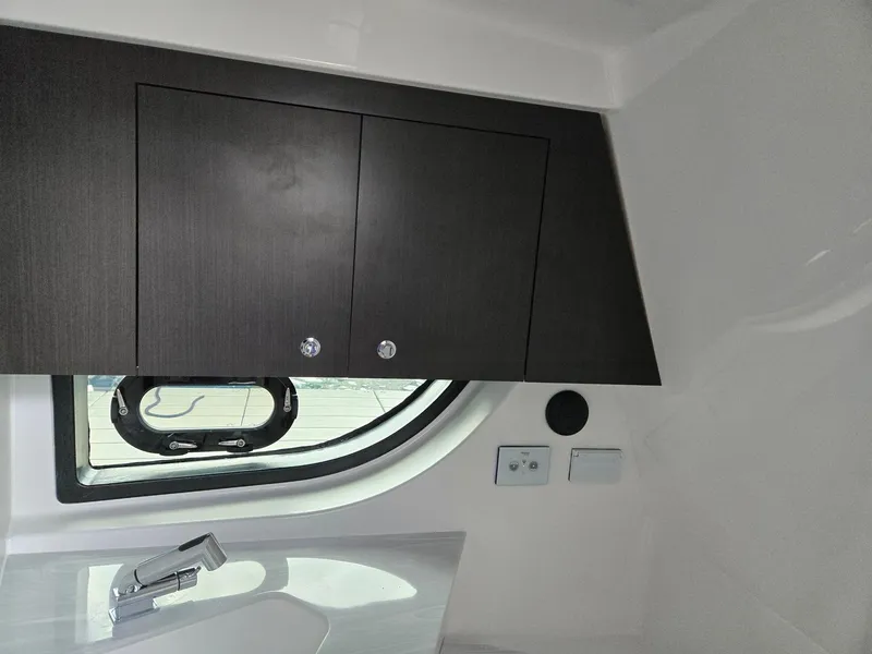 Slide: The Image of 2026 Hurricane SunDeck 3200 OB boat interior with sleek design and modern features. - 34