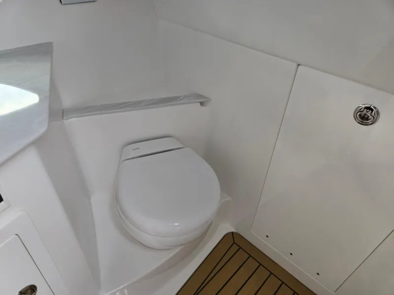 Slide: The Image of 2026 Hurricane SunDeck 3200 OB boat interior with seating and table. - 37