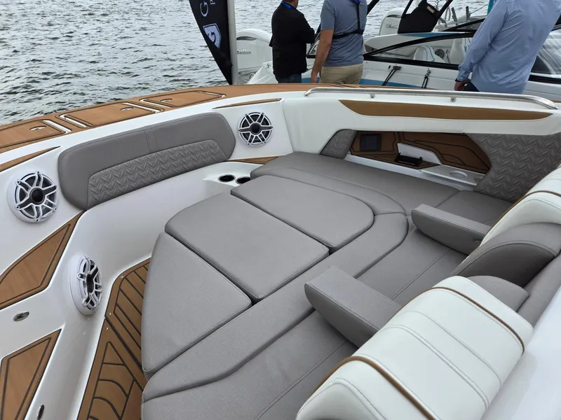 Slide: The Image of 2026 Hurricane SunDeck 3200 OB boat interior with storage compartments and seating. - 38