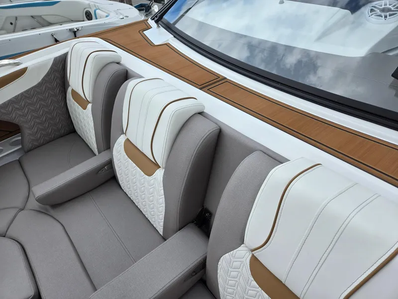 Slide: The Image of Interior view of 2026 Hurricane SunDeck 3200 OB boat, featuring seating and cup holders. - 39