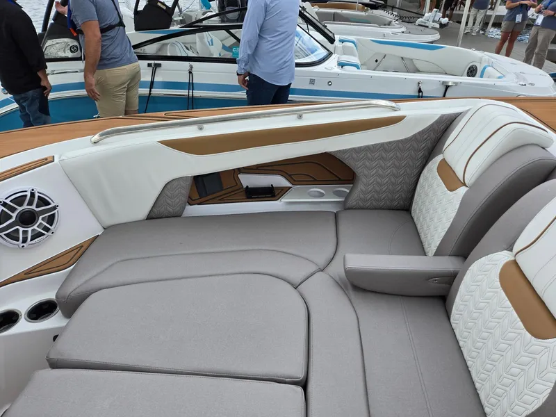 Slide: The Image of 2026 Hurricane SunDeck 3200 OB boat interior with cushioned seating and cup holders. - 40