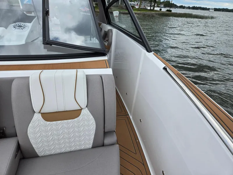 Slide: The Image of 2026 Hurricane SunDeck 3200 OB interior with cushioned seating and sleek design. - 43