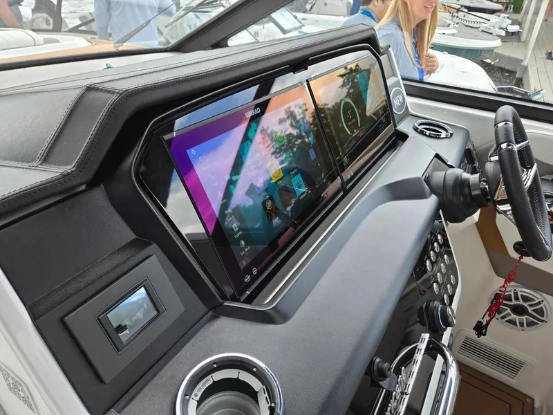 Slide: The Image of 2026 Hurricane SunDeck 3200 OB boat interior with seating, table, and modern design. - 45