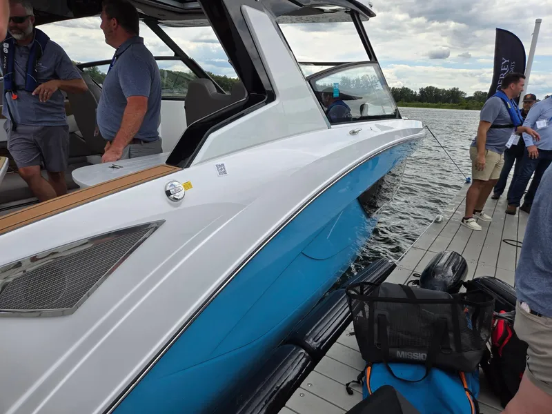 Slide: The Image of Interior view of 2026 Hurricane SunDeck 3200 OB boat with sunroof detail. - 49