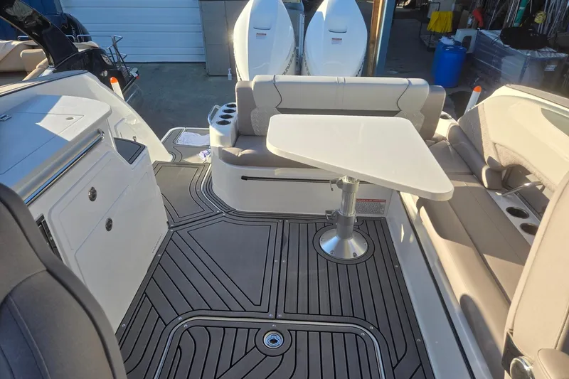 Slide: The Image of 2026 Hurricane SunDeck 3200 OB boat interior with seating, table, and modern design. - 50