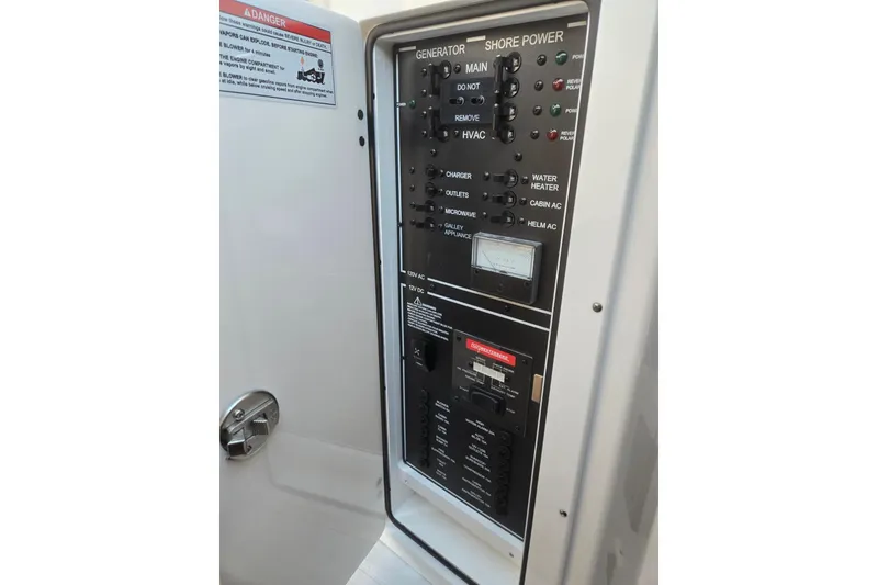 Slide: The Image of Electrical control panel on 2026 Hurricane SunDeck 3200 OB boat. - 55