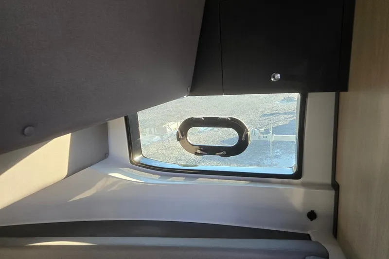 Slide: The Image of Interior view of 2026 Hurricane SunDeck 3200 OB boat window with sleek design. - 61