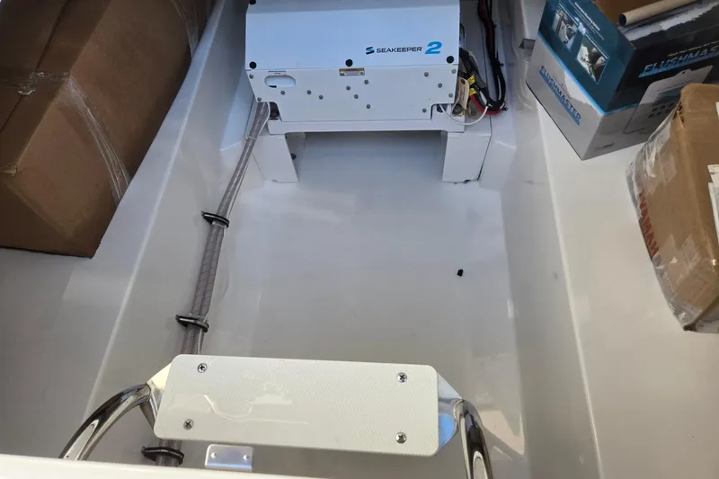 Slide: The Image of 2026 Hurricane SunDeck 3200 OB interior with Seakeeper 2 stabilizer installation. - 73