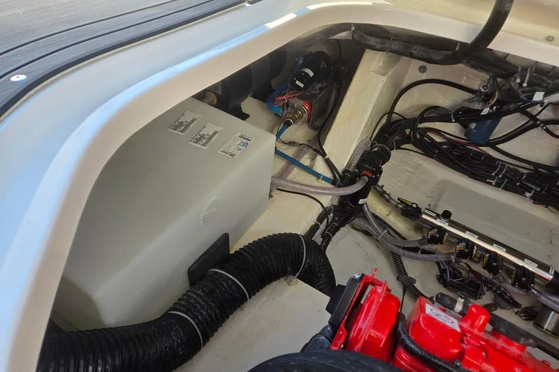 Slide: The Image of 2026 Hurricane SunDeck 3200 OB engine compartment with wiring and components. - 78