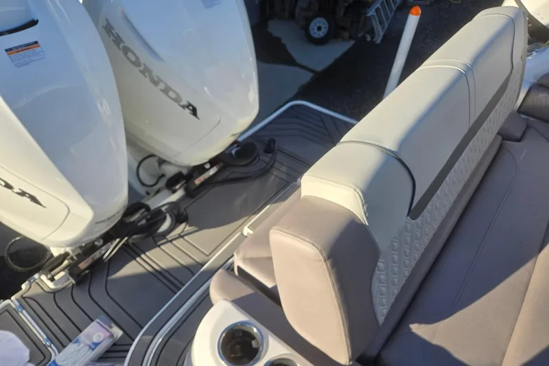 Slide: The Image of 2026 Hurricane SunDeck 3200 OB boat with Honda outboard engines and comfortable seating. - 86