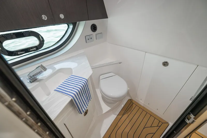 Slide: The Image of 2026 Hurricane SunDeck 3200 OB boat interior with seating and table, featuring modern design. - 9