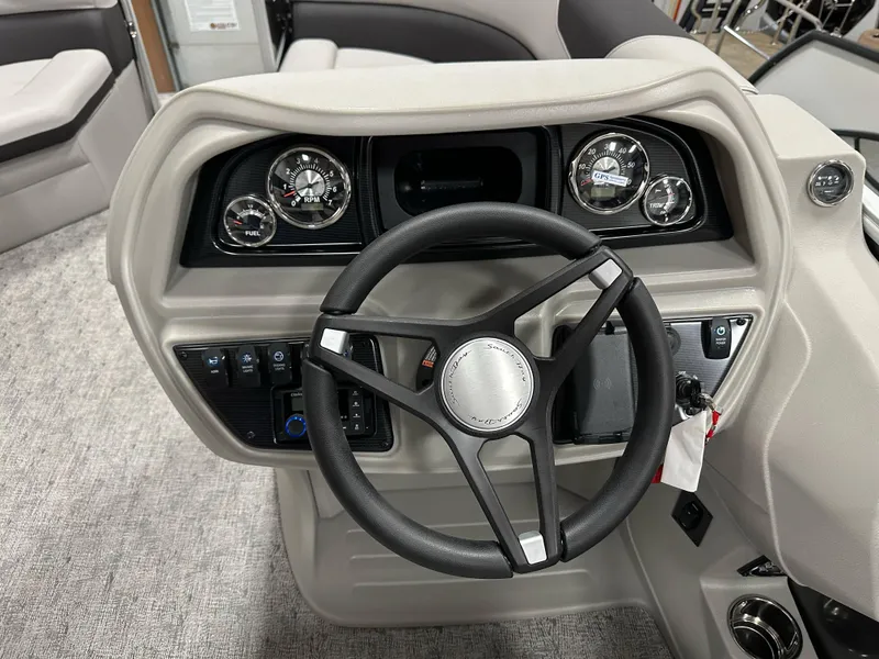 Slide: The Image of Steering console of 2025 South Bay 222FCR LE boat with gauges and controls. - 15