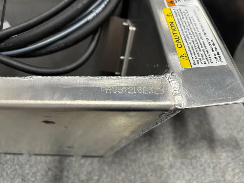 Slide: The Image of Close-up of South Bay 222FCR LE 2025 metal component with caution label and serial number. - 20