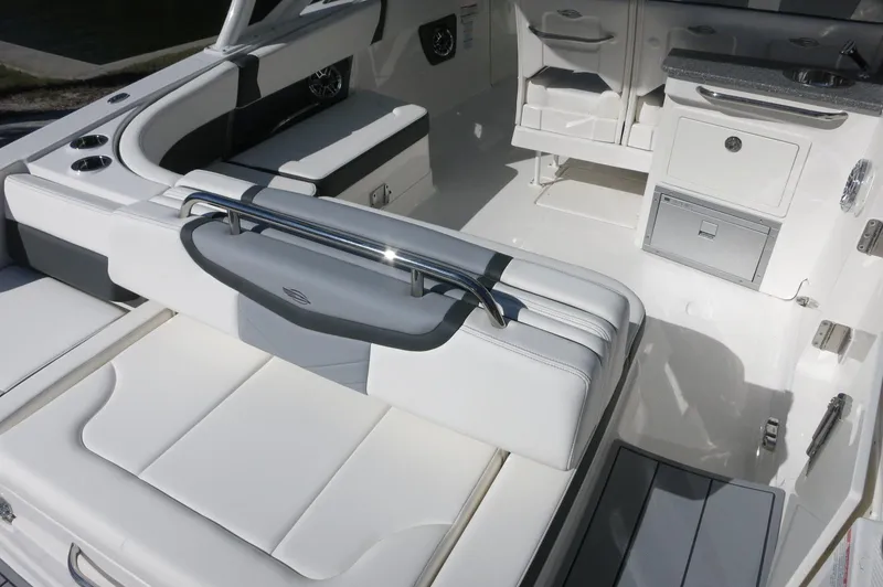 Slide: The Image of 2025 Chaparral 280 OSX Bowrider interior with white seating and sleek design. - 17