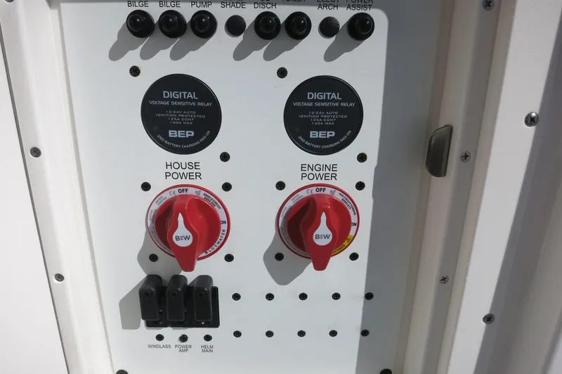 Slide: The Image of Control panel of 2025 Chaparral 280 OSX Bowrider with power switches and digital displays. - 19