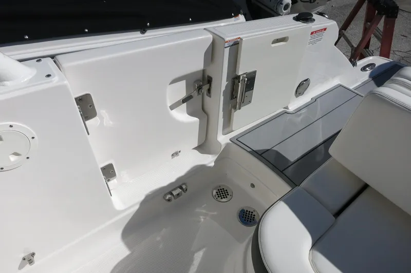 Slide: The Image of 2025 Chaparral 280 OSX Bowrider interior, featuring sleek white seating and modern design elements. - 21