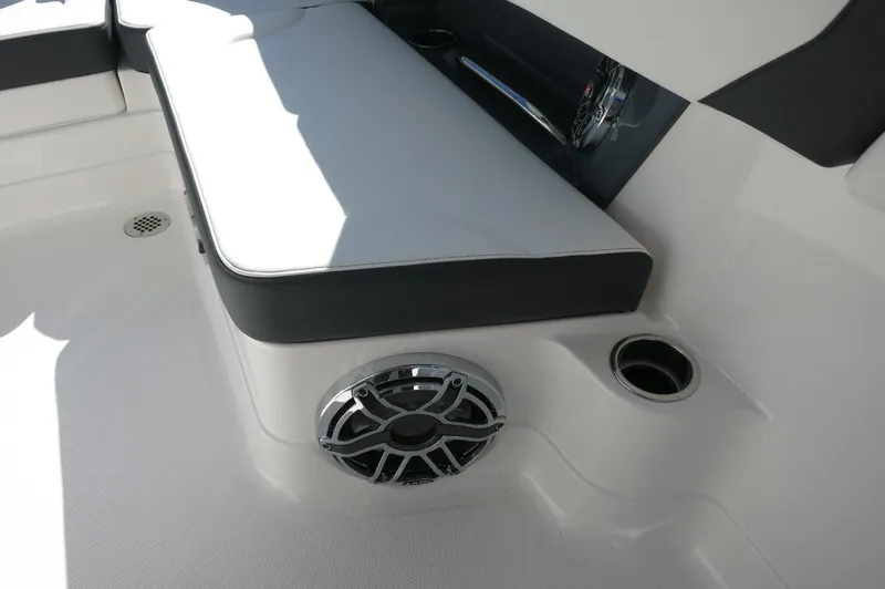 Slide: The Image of 2025 Chaparral 280 OSX Bowrider interior with cushioned seating and built-in speaker. - 26