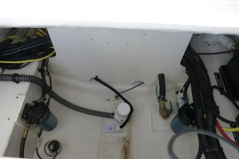 Slide: The Image of 2025 Chaparral 280 OSX Bowrider engine compartment with wiring and components. - 32