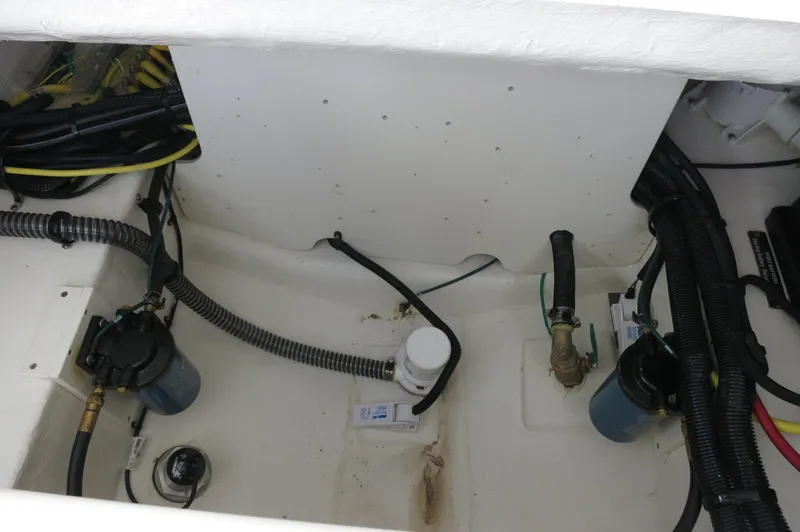 Slide: The Image of Engine compartment of 2025 Chaparral 280 OSX Bowrider with visible hoses and components. - 33