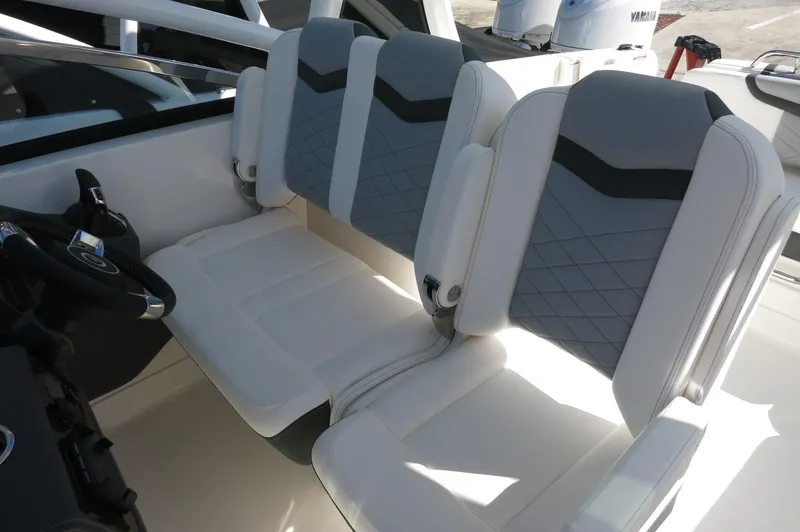 Slide: The Image of 2025 Chaparral 280 OSX Bowrider interior with modern seating and steering wheel. - 36