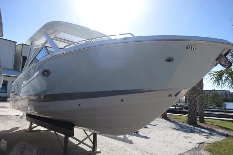 Slide: The Image of 2025 Chaparral 280 OSX Bowrider boat on display, showcasing sleek design and modern features. - 4