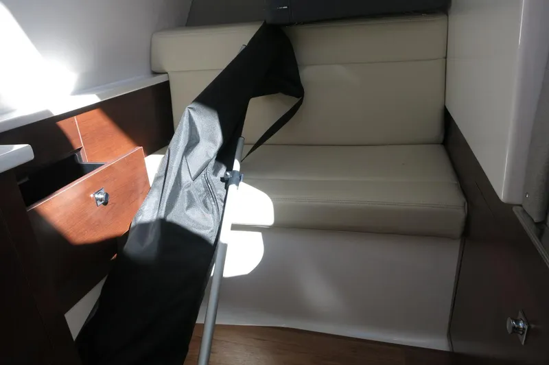 Slide: The Image of 2025 Chaparral 280 OSX Bowrider interior with seating and storage. - 42