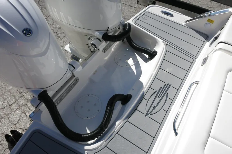 Slide: The Image of 2025 Chaparral 280 OSX Bowrider boat deck with dual outboard motors. - 49