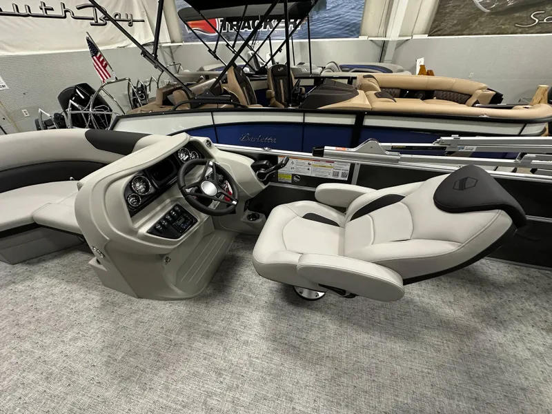 Slide: The Image of 2025 South Bay 222FCR LE 2.75 boat dashboard with steering wheel and controls. - 10
