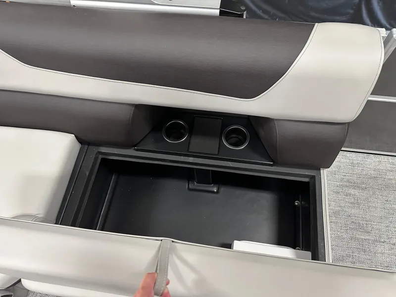 Slide: The Image of 2025 South Bay 222FCR LE 2.75 boat interior storage compartment with cushioned seating. - 13
