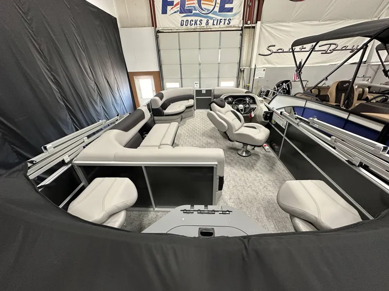 Slide: The Image of 2025 South Bay 222FCR LE 2.75 pontoon boat displayed indoors, rear view. - 17