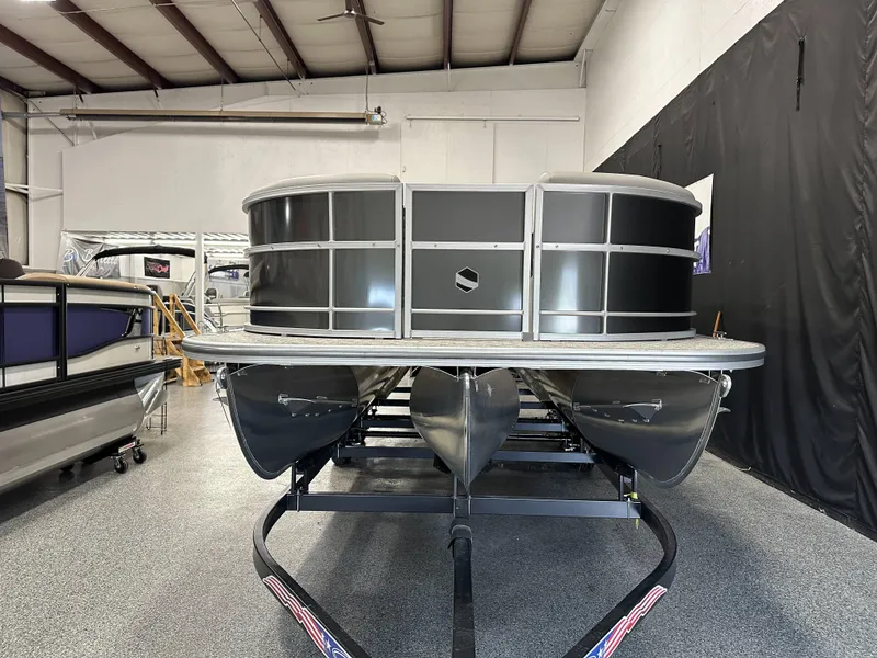 Slide: The Image of 2025 South Bay 222FCR LE 2.75 pontoon boat displayed indoors. - 3