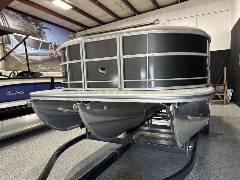 Slide: The Image of 2025 South Bay 222FCR LE 2.75 pontoon boat in showroom, side view. - 4