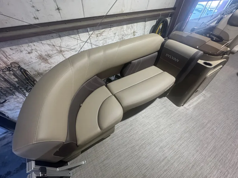 Slide: The Image of 2025 Sylvan Mirage 8520 Cruise boat interior with beige seating and modern design. - 2