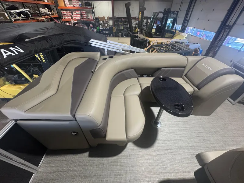 Slide: The Image of Luxurious seating on 2025 Sylvan Mirage 8520 Cruise pontoon boat in showroom. - 7