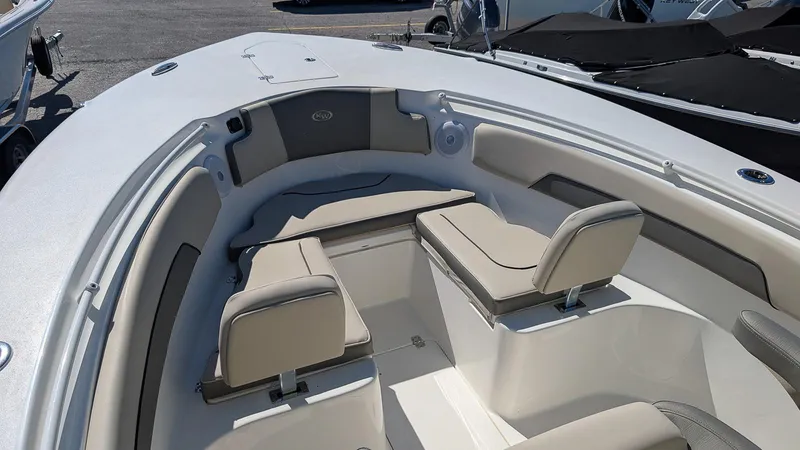 Slide: The Image of 2025 Key West 260 CC boat interior with cushioned seating and sleek design. - 19